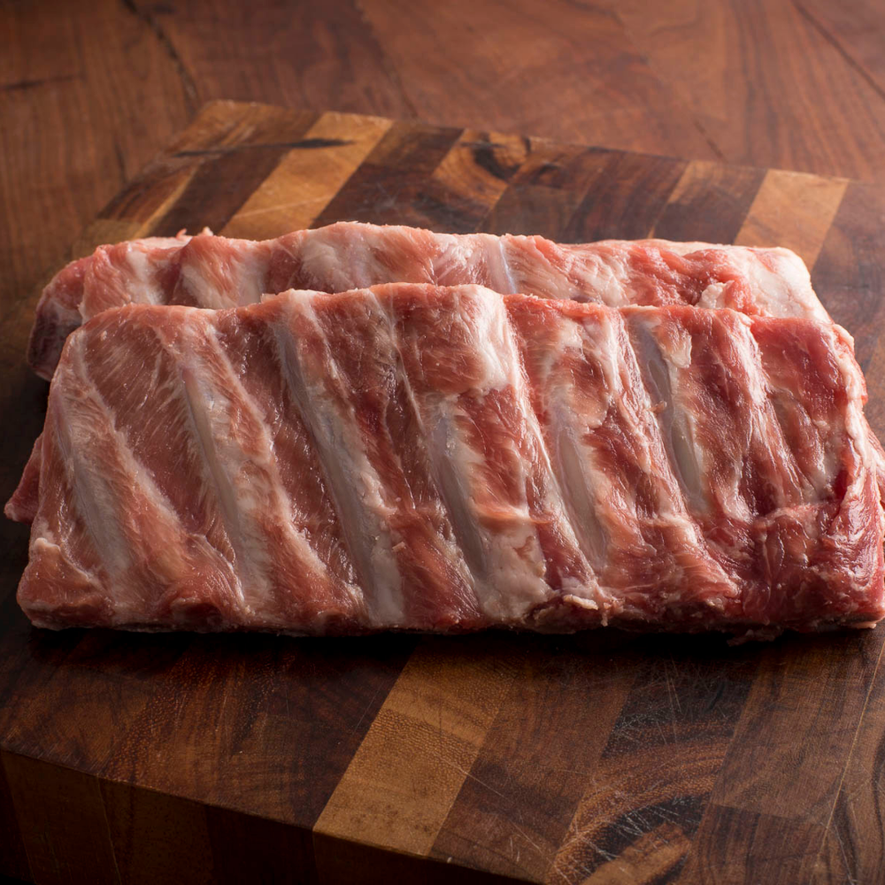 Grass roots Farmers' Co-op Pork Spare Ribs: St. Louis style pork spare ribs are meatier and have more fat marbling and flavor than baby backs. Their richness pairs beautifully with a sweet or tangy barbecue sauce, or prepared simply with a seasoned dry rub. The classic cooking method for St. Louis-style spare ribs is to smoke or grill them low and slow, you can also slow cook them in the oven to achieve that sought-after fall-off-the-bone tenderness. -Weight app. 2.5–3 lbs.