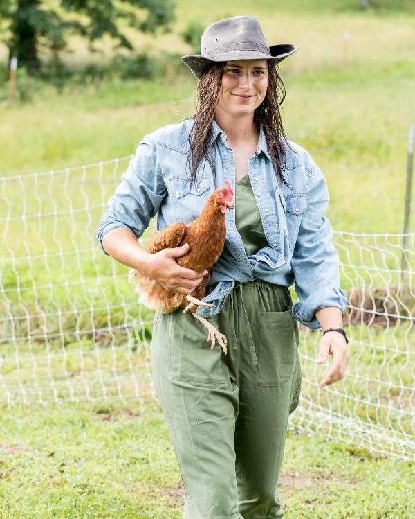 Woman holding chicken.jpg__PID:61fe27e5-cbae-477e-9d30-bf28fffa9013